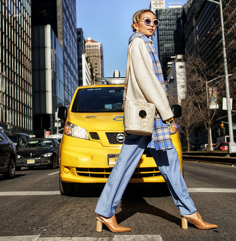 Helen Chik in brown camel shoes and snakeskin bucket bag NYC